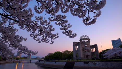 hiroshima peace memorial park at sunset with cherry blossoms