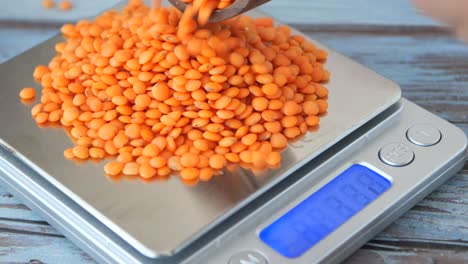 red lentils on a kitchen scale