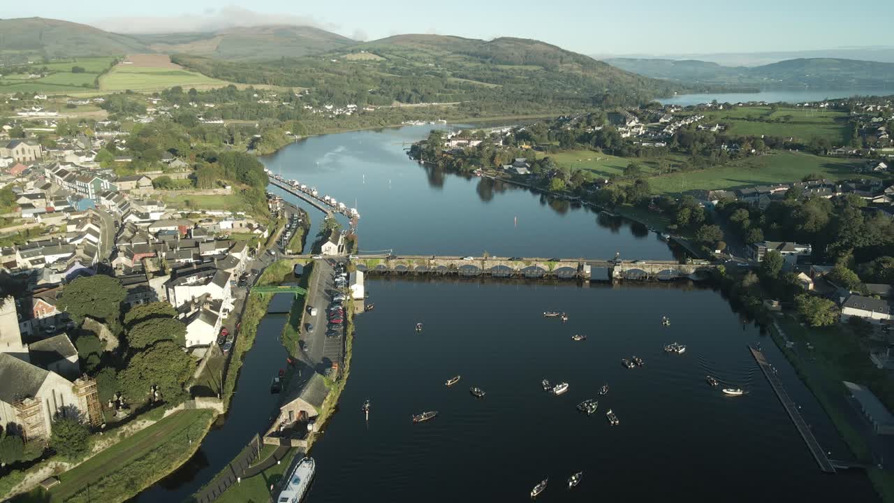 Fishing boats fill the calm river in Killaloe town during a fishing competition in Ireland