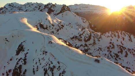 chamrousse ski resort summit tracks at the french alps with shelter cabin and ski lift, aerial orbit left shot