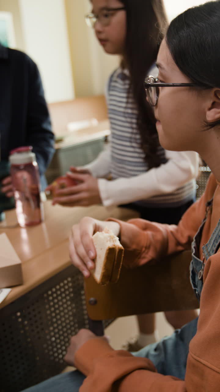 Students Enjoying Lunch Break in Classroom