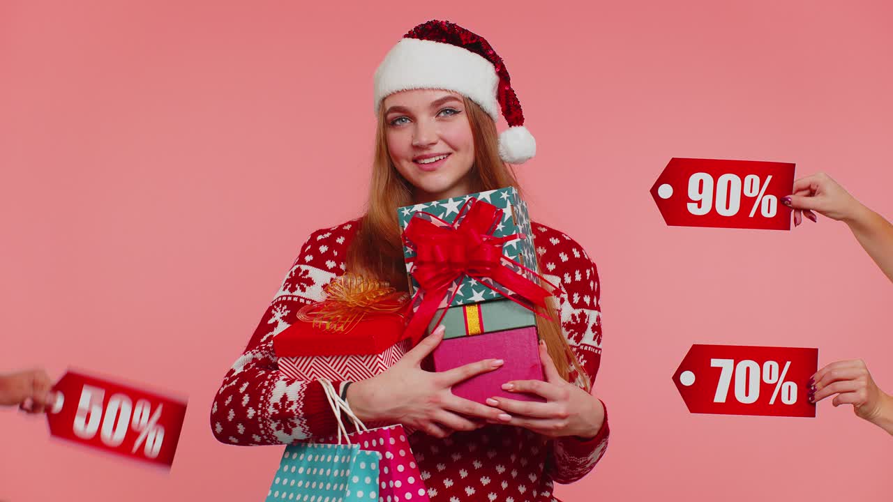 Girl holding gift boxes and receive christmas discounts inscriptions banner texts shopping sale