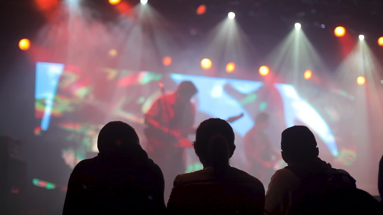 A live music performance with a band on stage