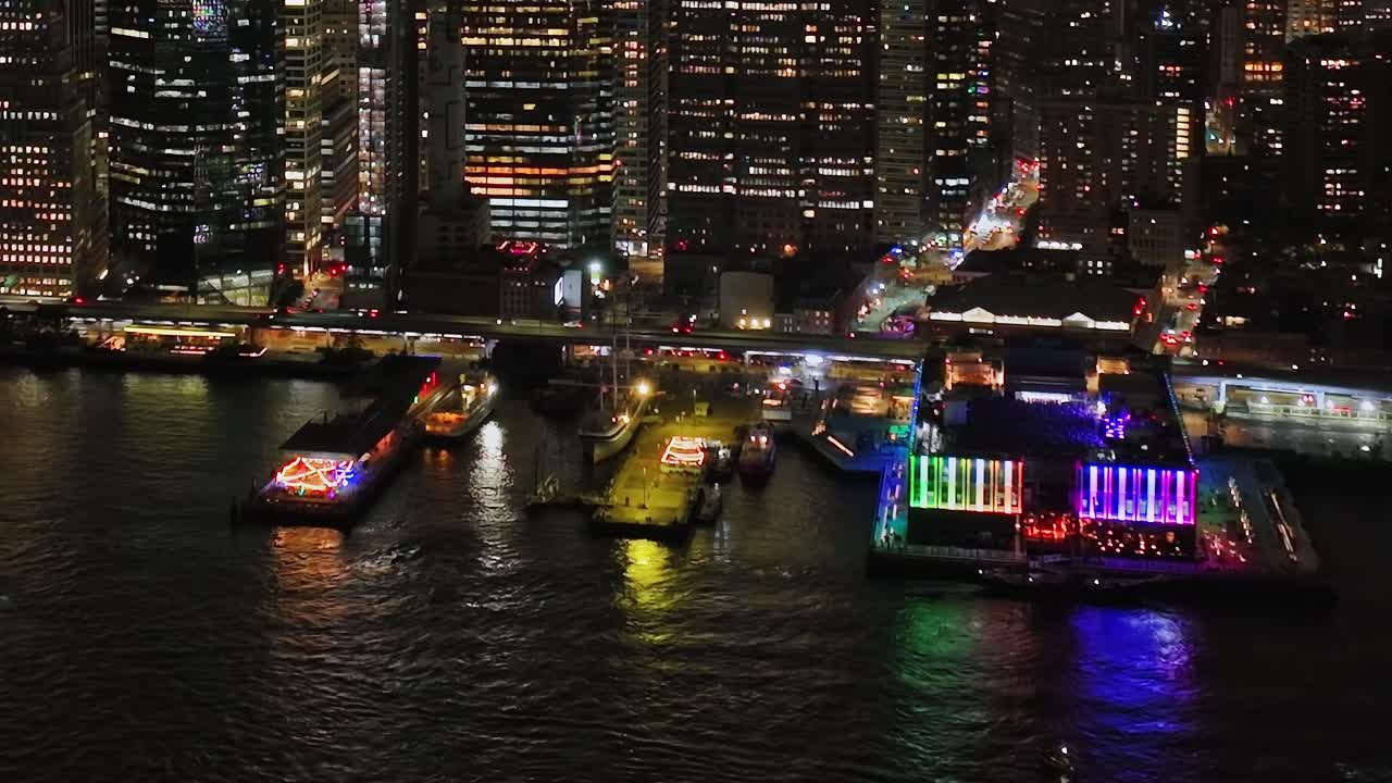 Aerial view of illuminated New York City waterfront at night