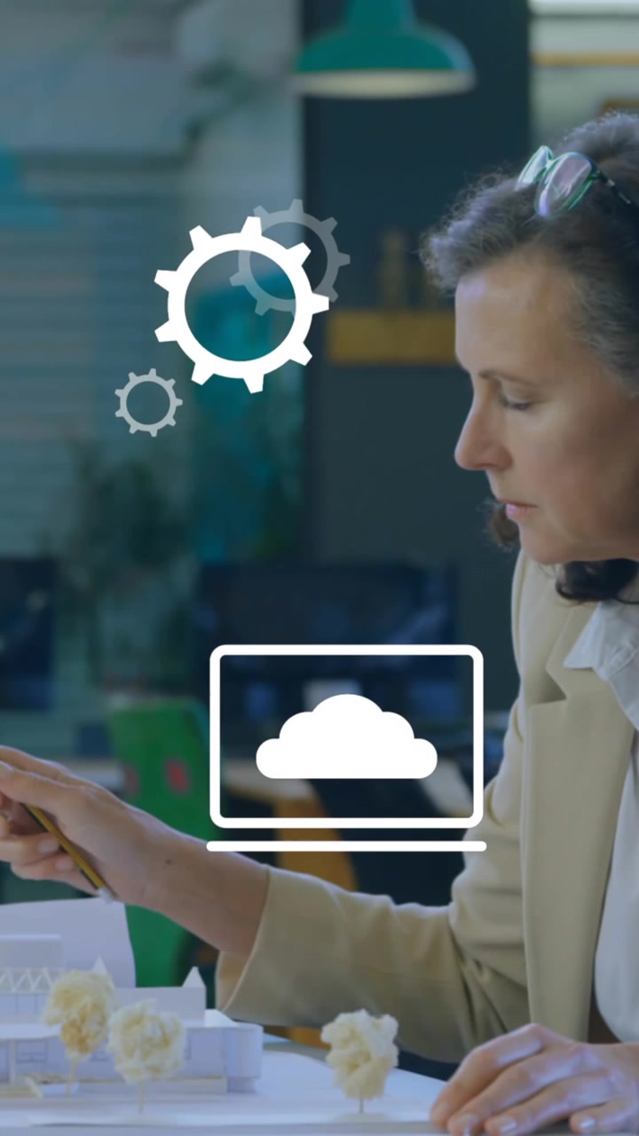 Animation of multiple digital icons against man working on his plan at office
