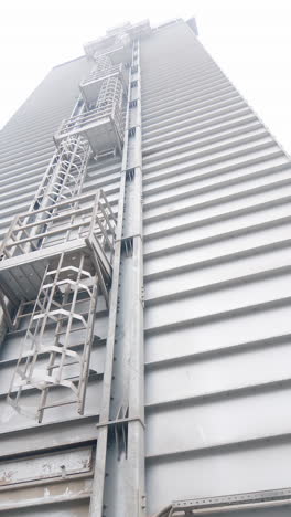 exterior of a large industrial building with access stairs