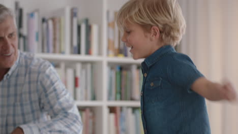 happy-grandfather-playing-with-little-boy-at-home-grandpa-having-fun-enjoying-game-with-grandson-jumping-on-sofa-family-weekend-4k-footage