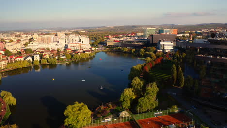 golden hour drone shot of iulius park and iulius mall in cluj-napoca city