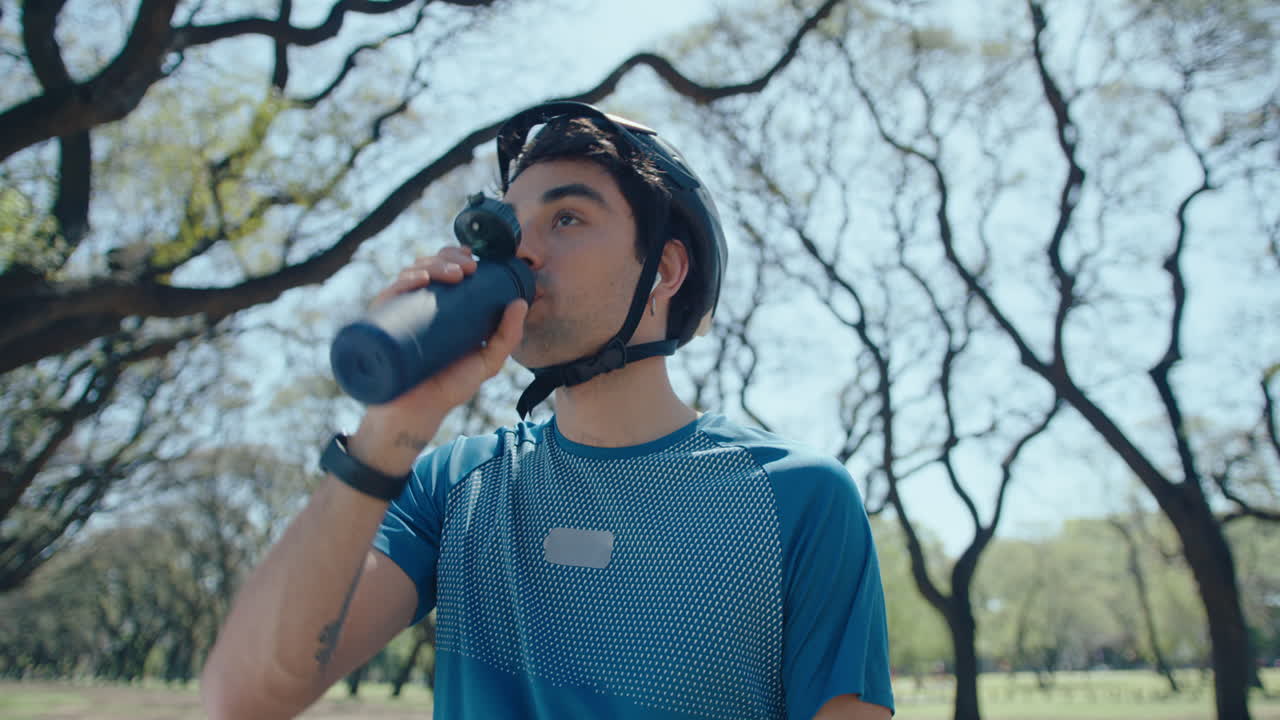 Cyclist Having Water Break during Bike Ride