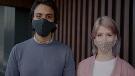 couple wearing masks outdoors