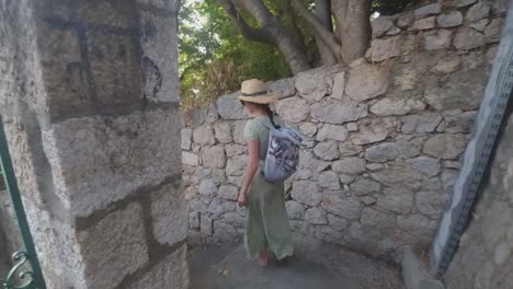 beautiful female model walking down the long stairs of dubrovnik