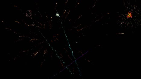 animation of colourful christmas and new year fireworks exploding in night sky