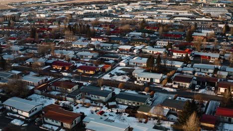 Aerial-flyover-Icelandic-residential-area-with-colorful-roof-in-winter-season