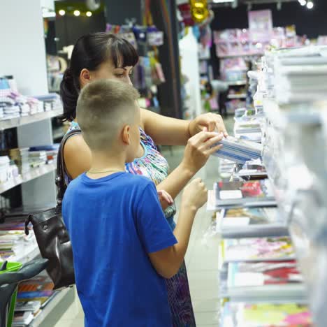 vinnitsa, ukraine - august 20, 2018: back to school concept. purchase of stationery in the store