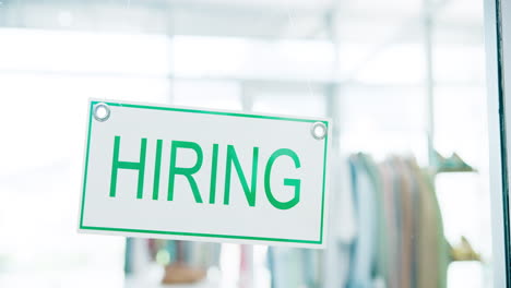 Hiring,-sign-on-window-of-shop-and-recruitment