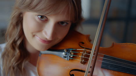 Girl-playing-violin-with-bow.-Musician-performing-musical-composition-on-violin