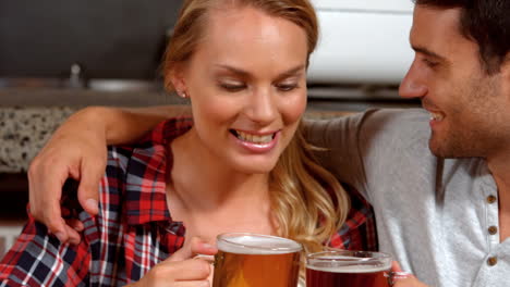 smiling couple having a drink together