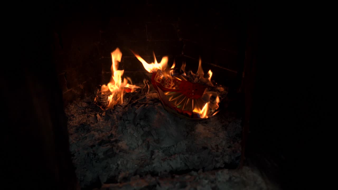 Joss paper burning in a Chinese Buddhist temple, a traditional spiritual offering for ancestors, push in