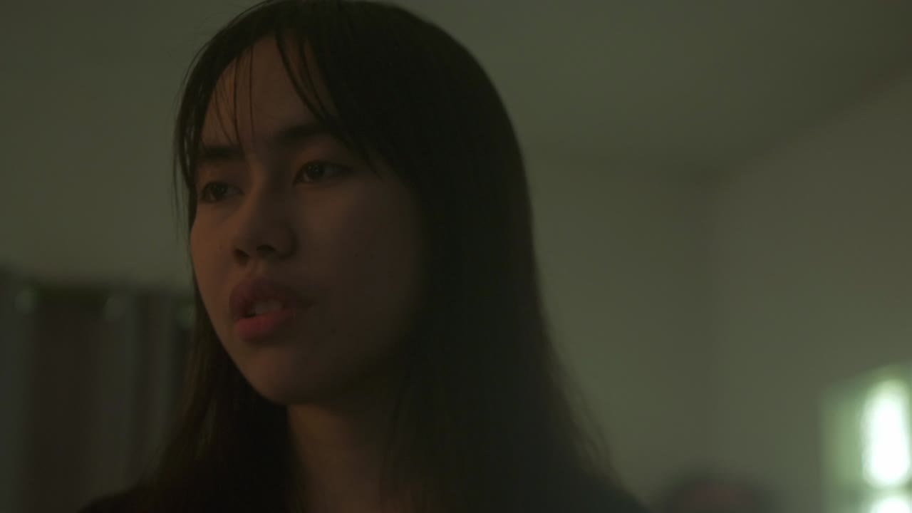 A Young Woman's Face Bears a Distant Expression, Reflecting Signs of Mental Illness - Close Up