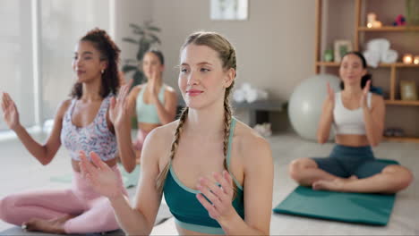 group of women doing yoga and meditation