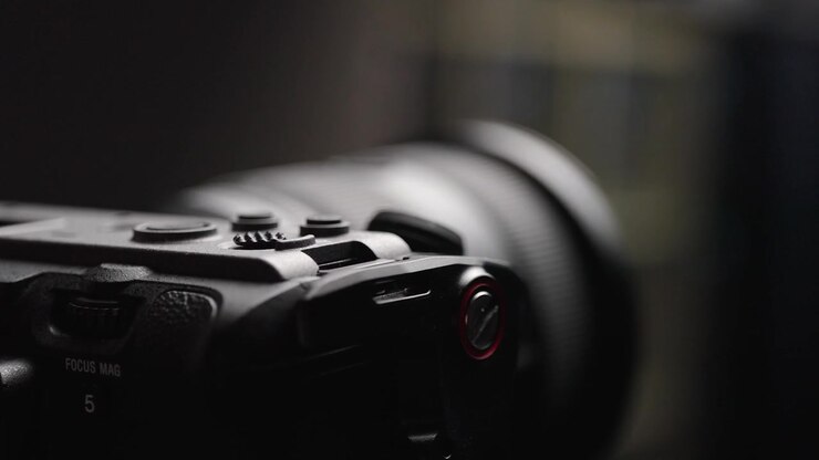 Close-up view of the lens cap being removed from the Sony FX3