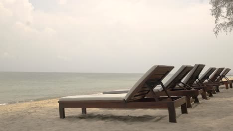 perspective views a row of sunbeds on the beach of thailand