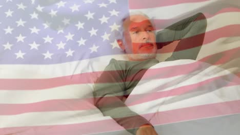 Animation-of-caucasian-man-in-bed-over-flag-of-usa