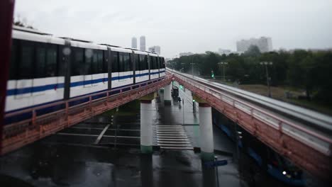 rainy day monorail ride through the city