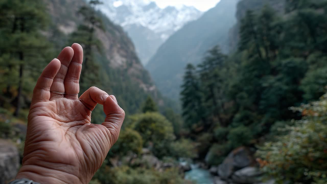 A Serene Gesture of Peace in a Breathtaking Mountain Landscape, Emphasizing Tranquility and Nature's Majesty Captured on Camera