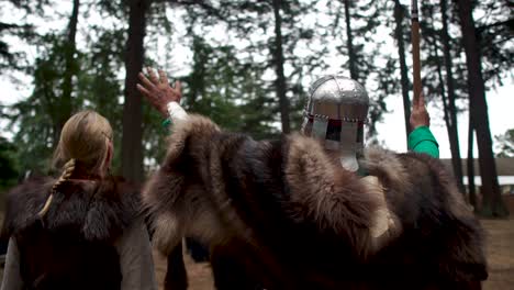 viking ceremony in which participants enthusiastically raise hands to the gods