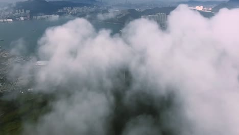 drone in clouds with city view stock footage