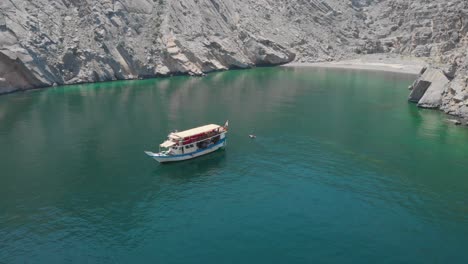 aerial shot from drone of a dhow cruise in gulf of oman, khasab