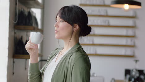 happy business woman manager drinking coffee enjoying successful entrepreneur lifestyle restaurant owner looking confident out window planning ahead brainstorming ideas for shop