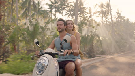 travel couple riding scooter on tropical island enjoying romantic ride exploring beautiful travel destination on motorcycle adventure