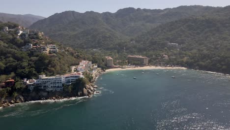 mismaloya beach the colorful sierra madre mountains meet the serene waters of the mexican pacific ocean at the beach of mismaloya, a quaint fishing village just 15 minutes south of puerto vallarta
