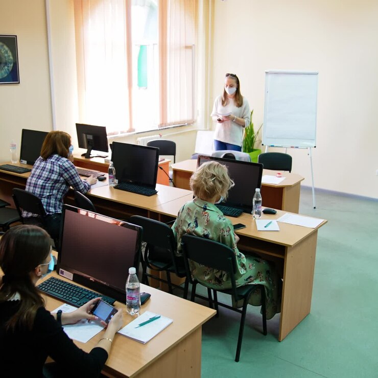 Female teacher is reading a lecture to the students. Ophthalmology course at medical university