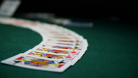 Playing-cards-arranged-on-poker-table-4k