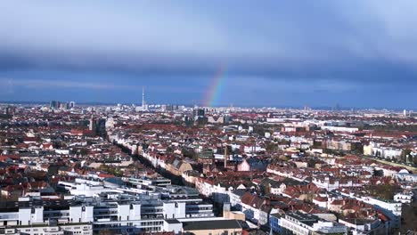 rainbow in sky over tv tower city berlin gay lesbian capital of homosexuals