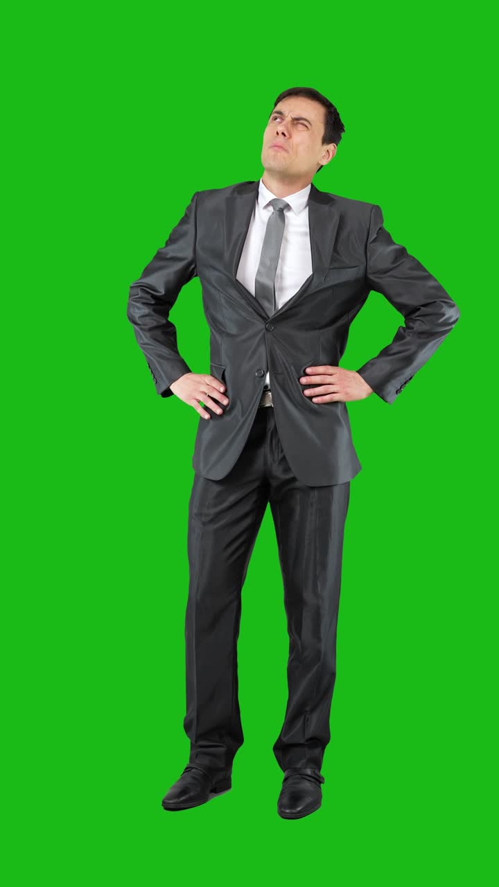 Man in a Suit on a Green Screen