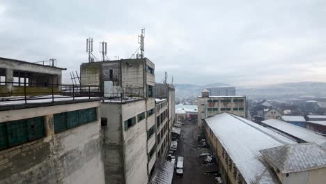 aerial view of abandoned industrial building on a cloudy moody day in east european town