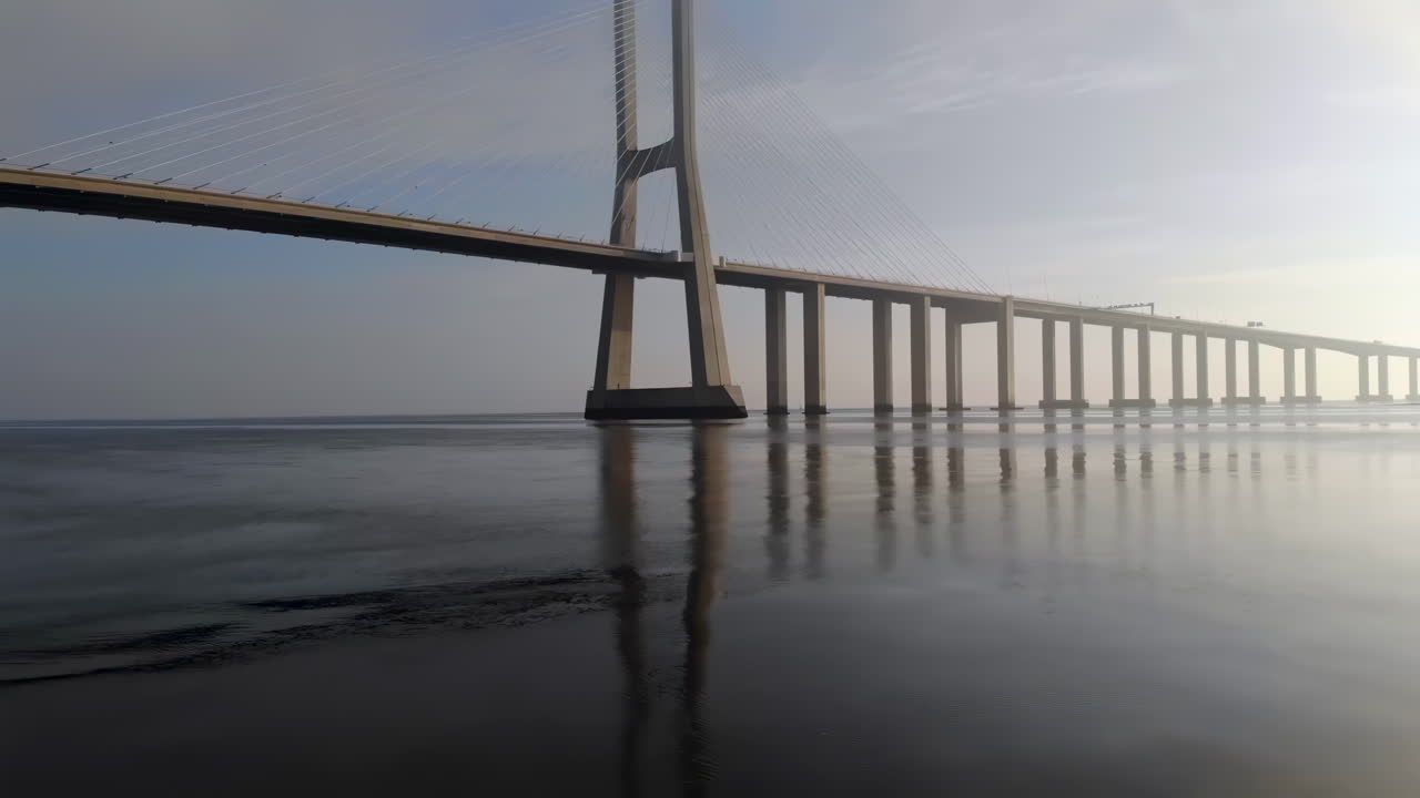 The Vasco da Gama cable-stayed bridge flanked by viaducts that spans the Tagus River in Parque das Nacoes in Lisbon