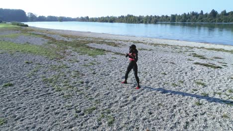 Drone-shot-of-young-attractive-black-female-doing-sports-outdoors