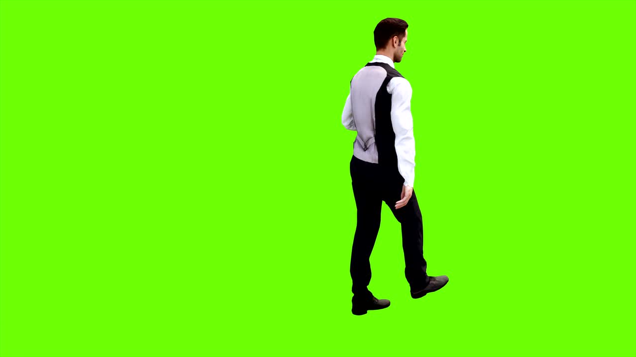 Young businessman walking in a circle on a green screen background. Looped animation. 4k