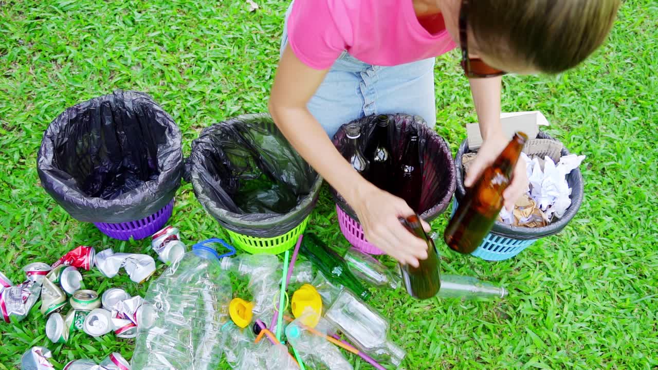 Woman Recycling in a Park