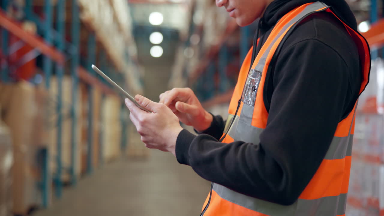Warehouse worker using tablet