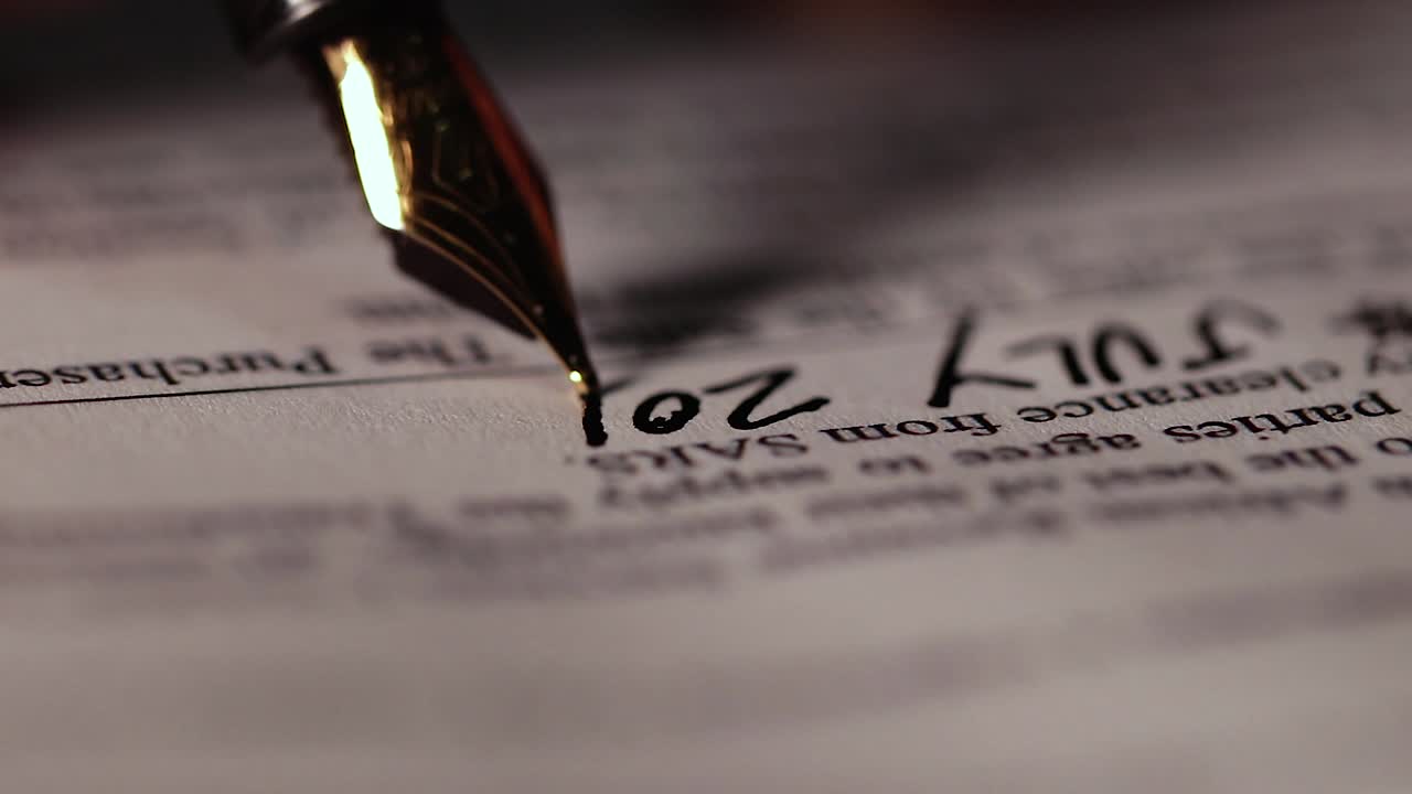 Business man signing contract paperwork with elegant fountain pen