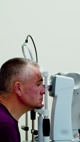 optometrist optician doctor examines patient