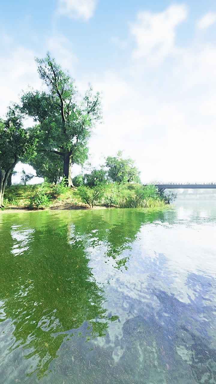 Serenity of a tranquil riverside landscape under a clear blue sky