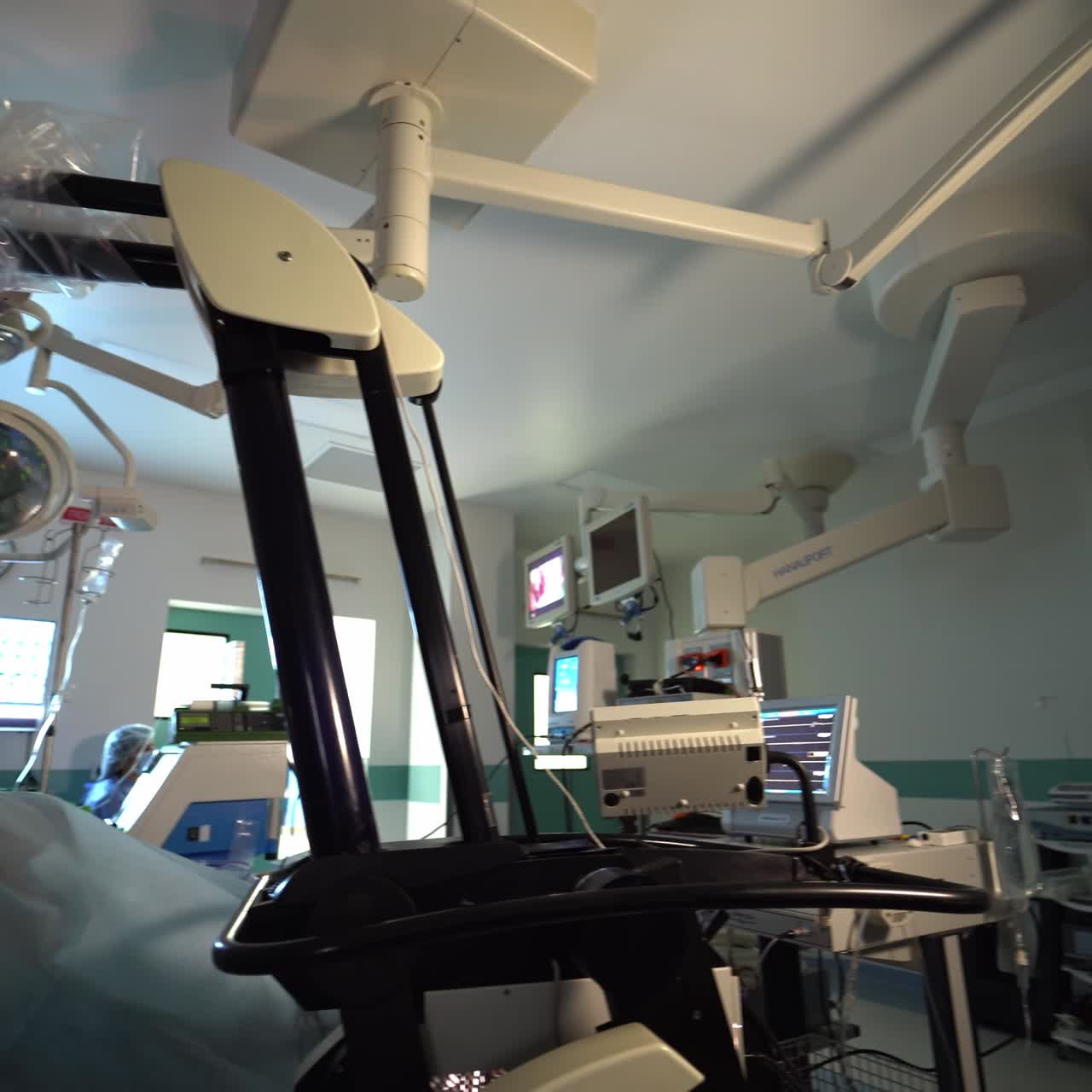Technological modern equipment in up-to-date surgery room. Doctors team operate the patient using advanced tools and devices