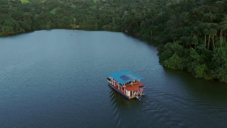 ferry tour on the the hatillo dam lake, dominican republic. journey near the tropical lake shores